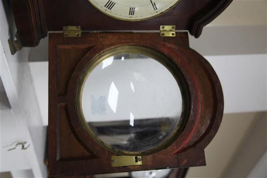 An early 19th century single pad top mahogany table clock, height 19in.